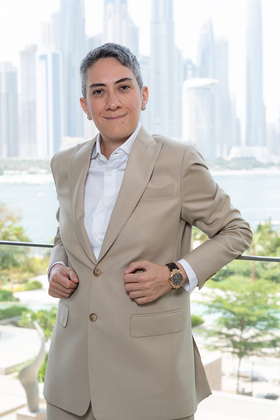 Honey Deylami on a balcony overlooking Palm Jumeirah and the Dubai skyline